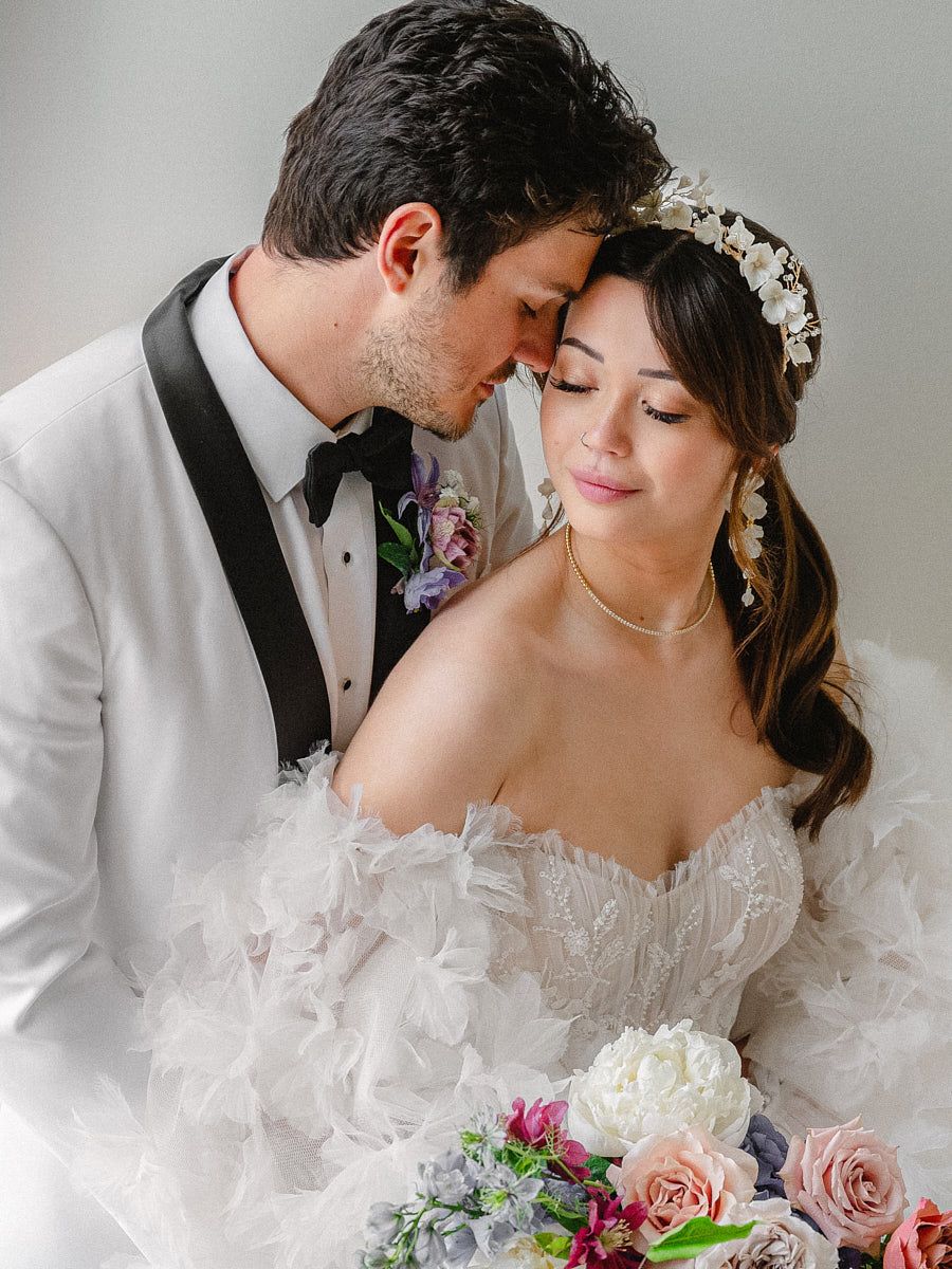 Tender moment with groom nuzzling bride, capturing intimate Riga wedding emotions