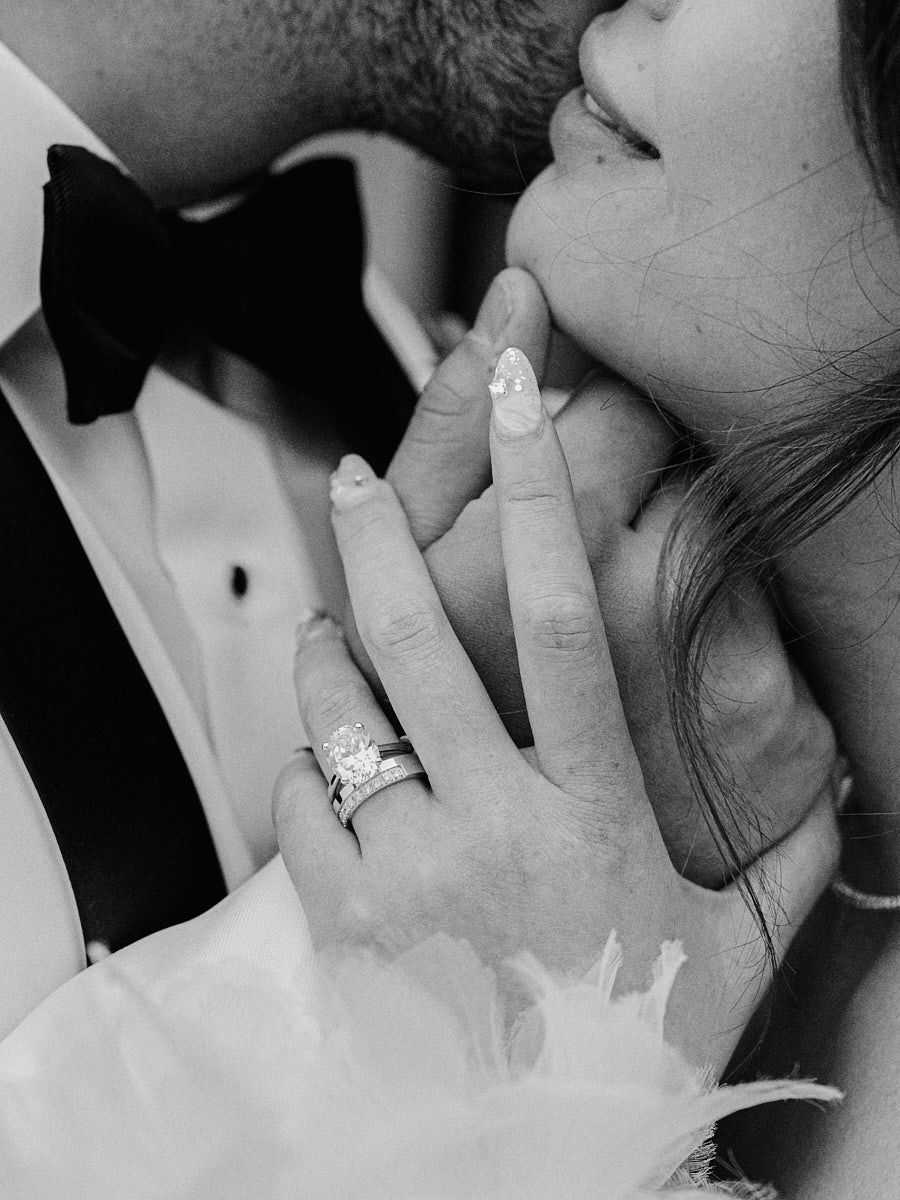 Bride’s hand showcasing wedding rings, highlighting elegant Riga wedding details