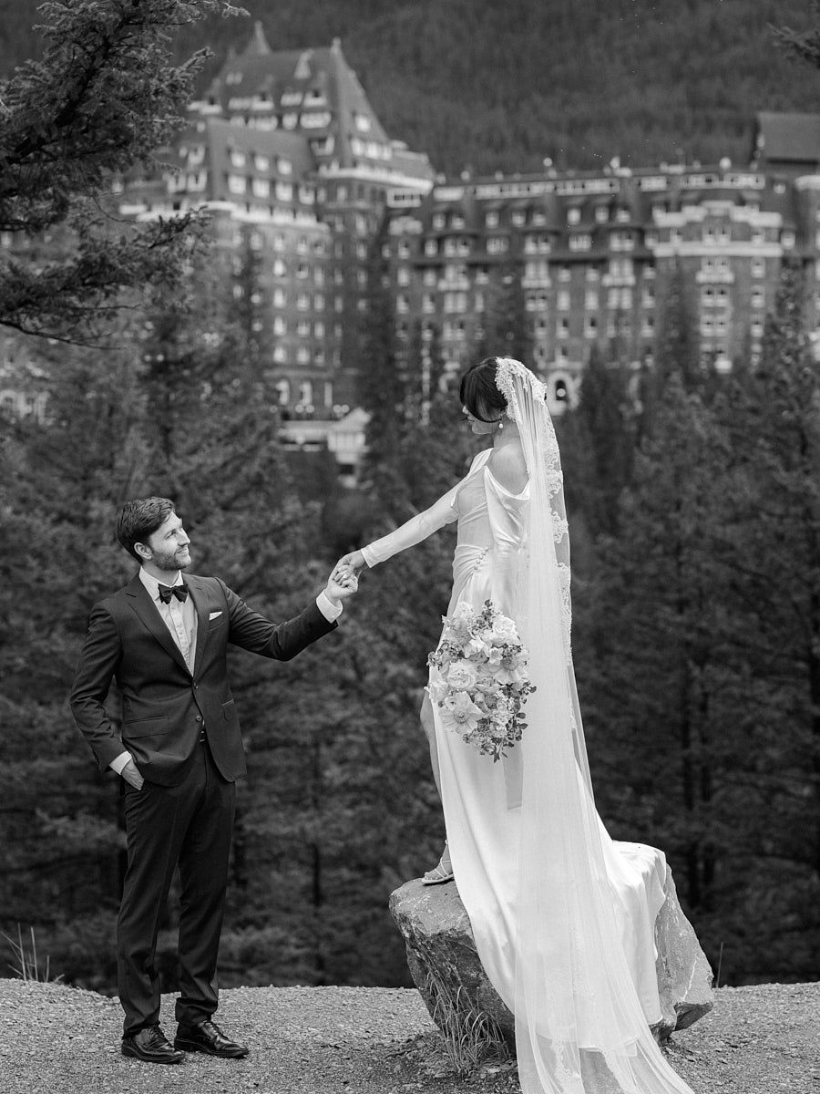 Baltic-inspired wedding photography with bride and groom by a castle in the forest