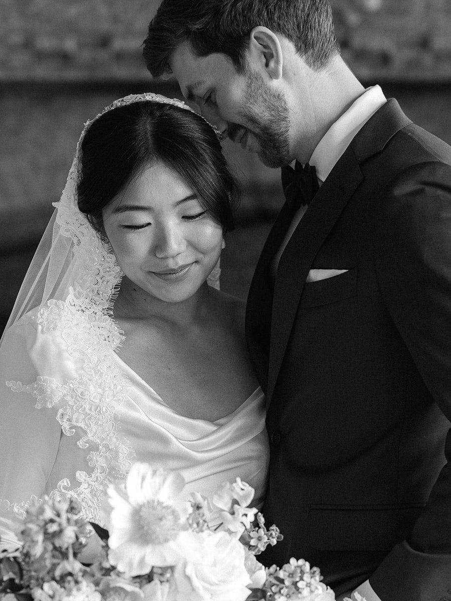 Intimate close-up of bride and groom in a historic castle, capturing romantic Riga wedding moments