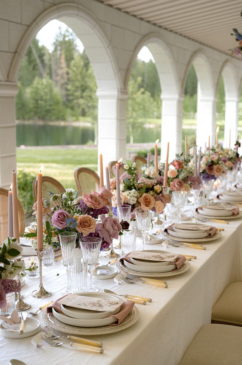 Chic pastel wedding tablescape featuring florals and elegant dinnerware for Riga weddings