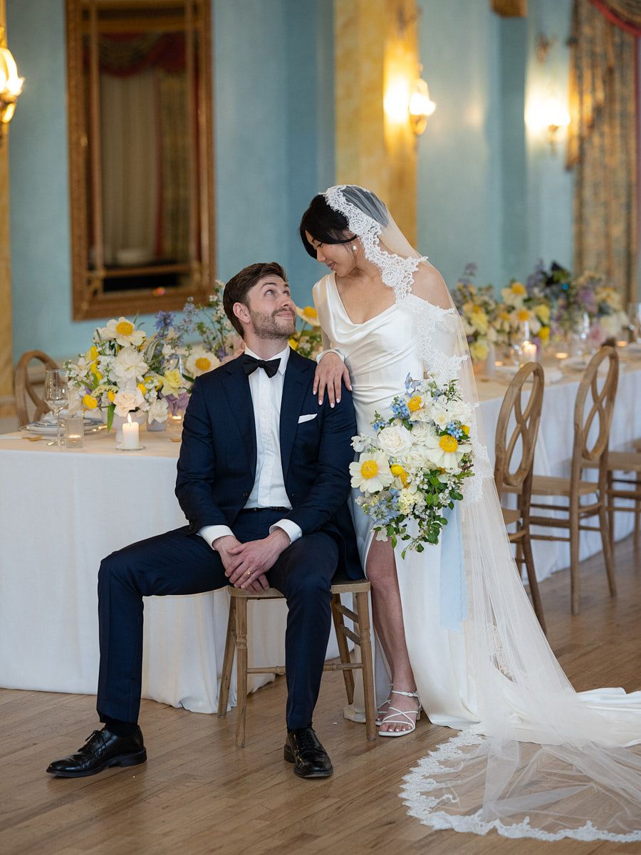 Romantic castle wedding portrait of bride and groom in luxurious surroundings