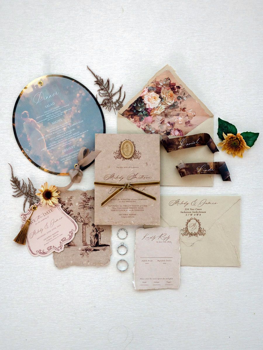 Renaissance-inspired wedding flatlay with rings and stationery, styled for a romantic Riga wedding aesthetic