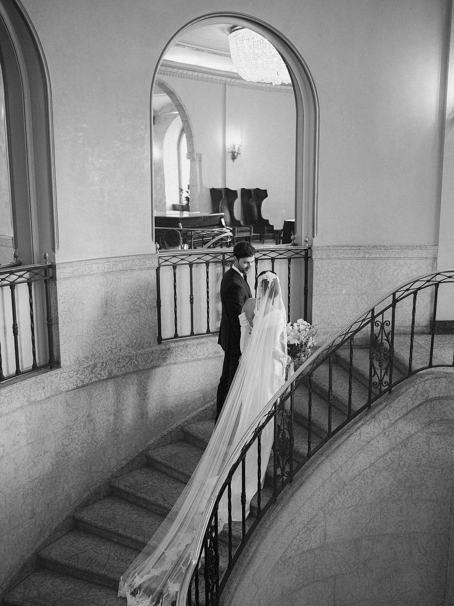 Scenic indoor wedding portrait of couple in a European castle setting
