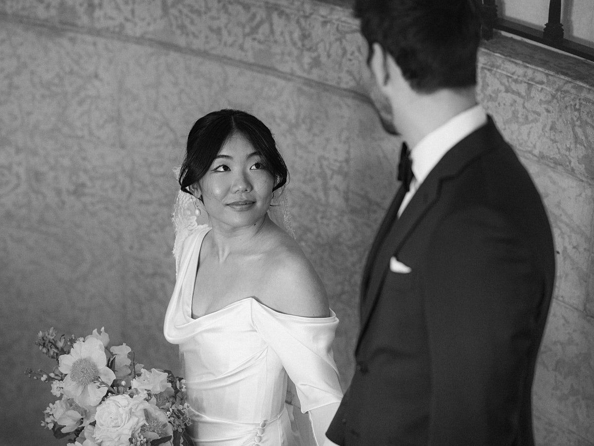 Romantic bride and groom enjoying private moment on castle stairs, ideal for Riga wedding photography