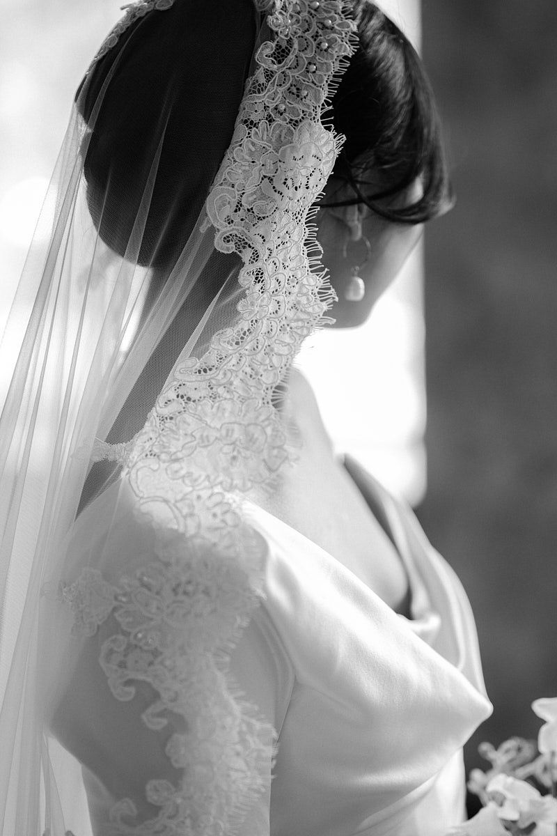 Elegant bride wearing a traditional Spanish veil, perfect for Riga wedding portraits