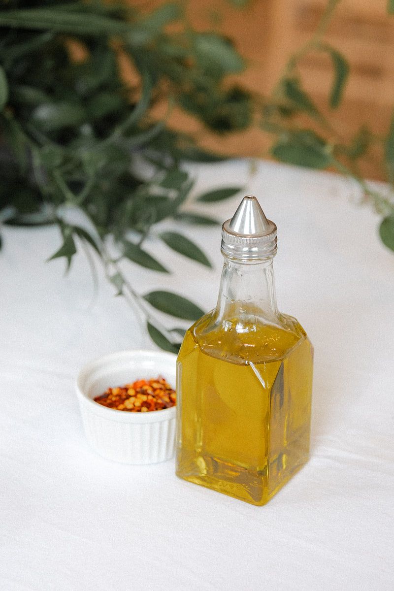 Olive oil served at Italian-style wedding dinner, highlighting Riga reception dining details