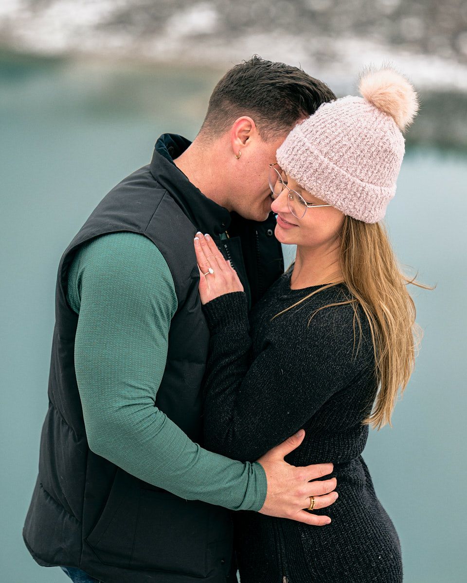 Proposal with “Will you marry me” scroll in scenic mountain engagement session in Europe