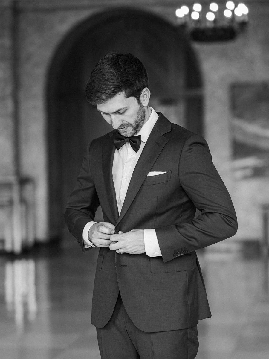 Elegant castle setting with groom getting ready for his wedding day, captured in natural light