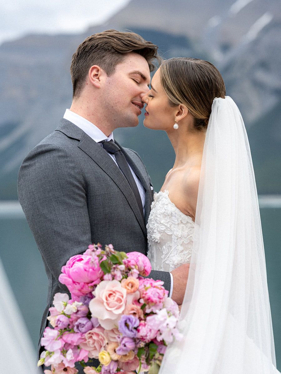 Bride and groom kissing, capturing romantic Riga wedding moments