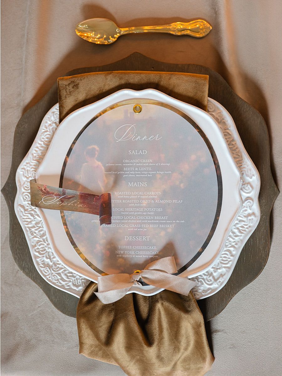 Wedding table setting with plate and candles, elegant Riga wedding reception detail shot