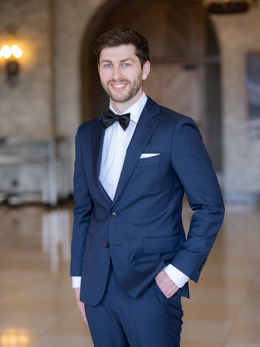 Groom preparing for wedding in a historic European castle, perfect for Riga wedding photography