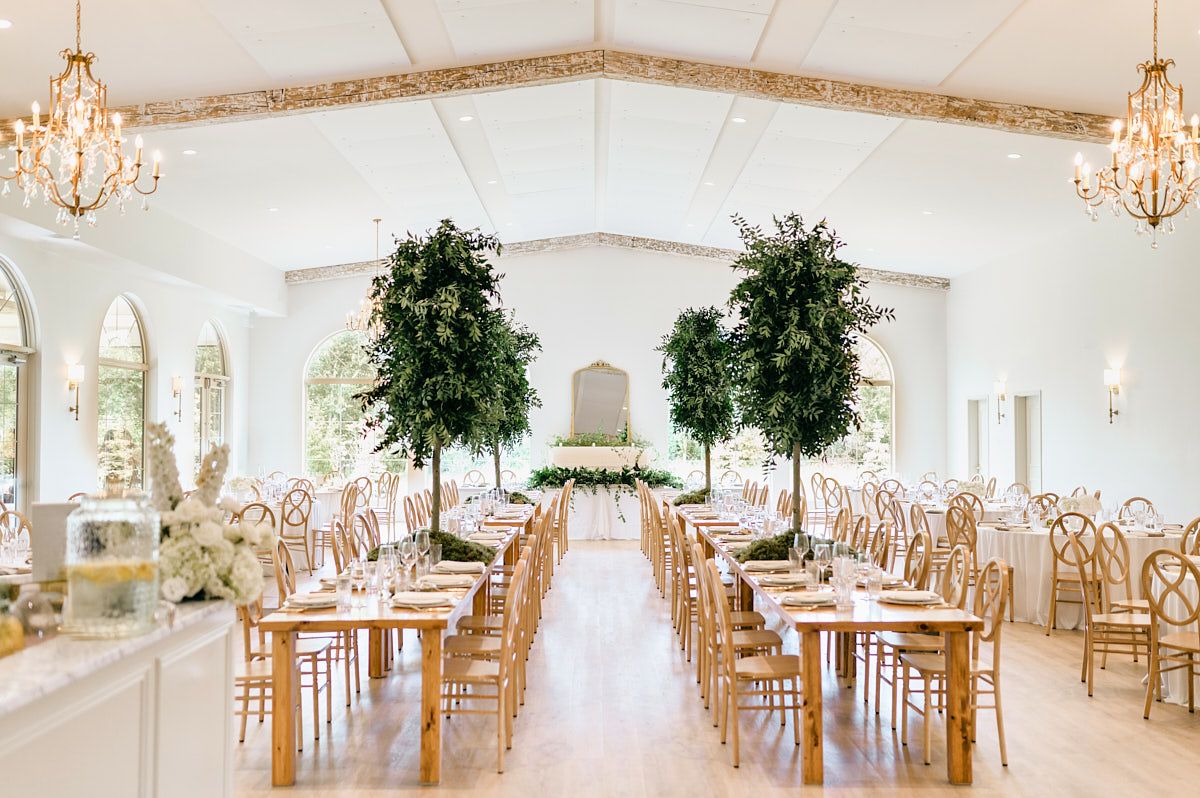 The Latvian venue reception hall, elegantly decorated with candlelit tables and romantic floral arrangements.