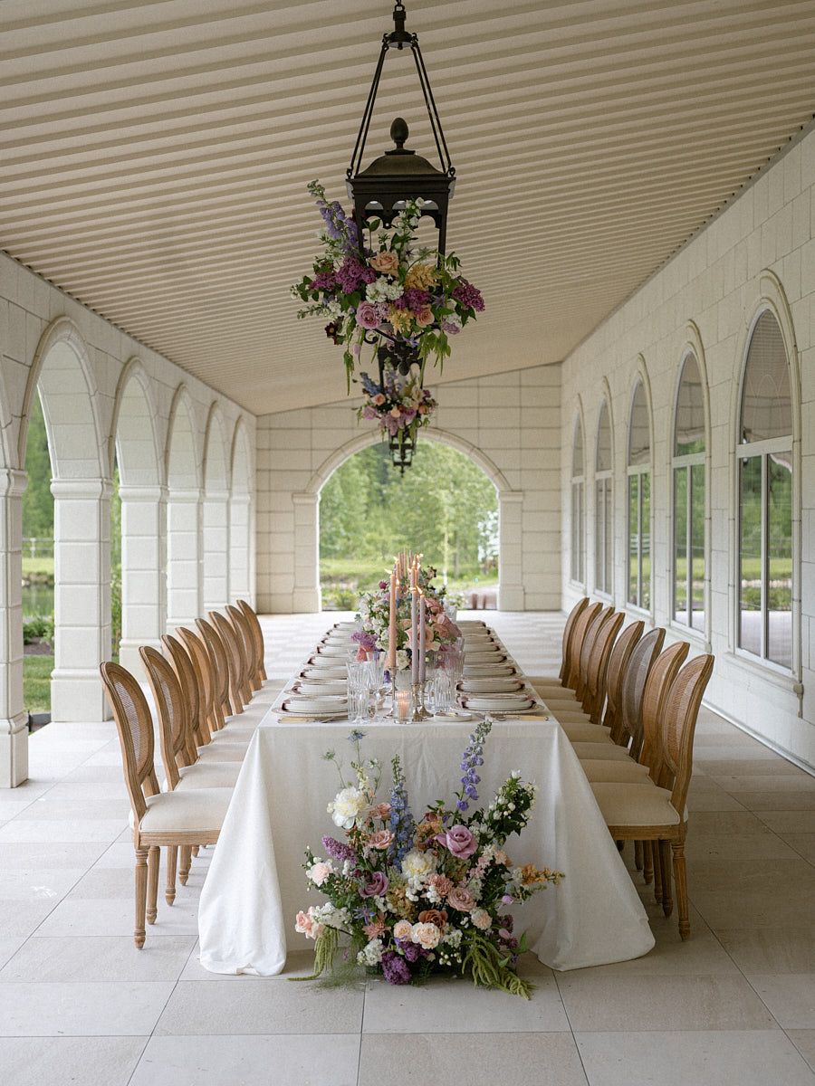 Elegant wedding reception table setup with plates, cutlery, and glassware, perfect for Riga celebrations