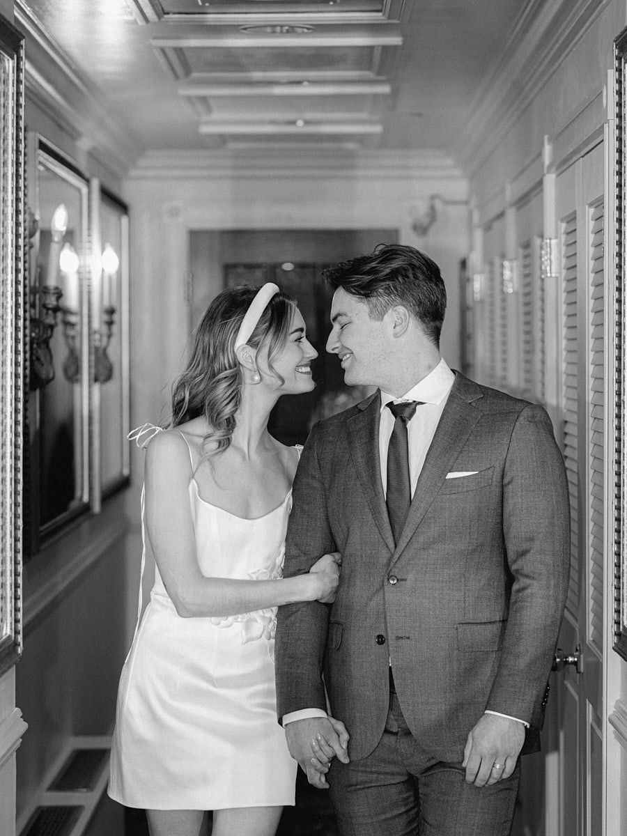 Newlyweds heading to their elegant Fairmont Hotel reception in Riga