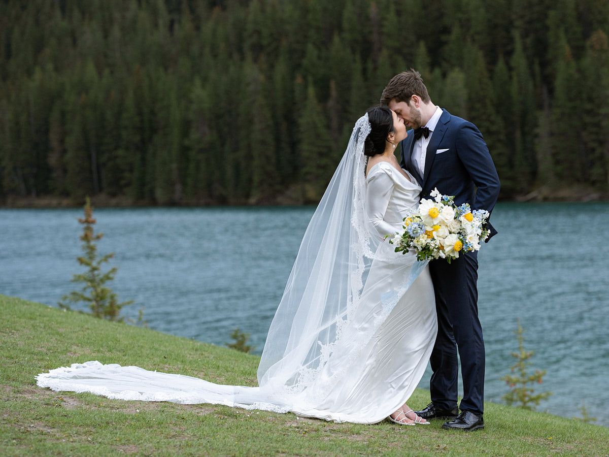 Romantic bride and groom portrait by a forested lake, ideal for Riga wedding photography