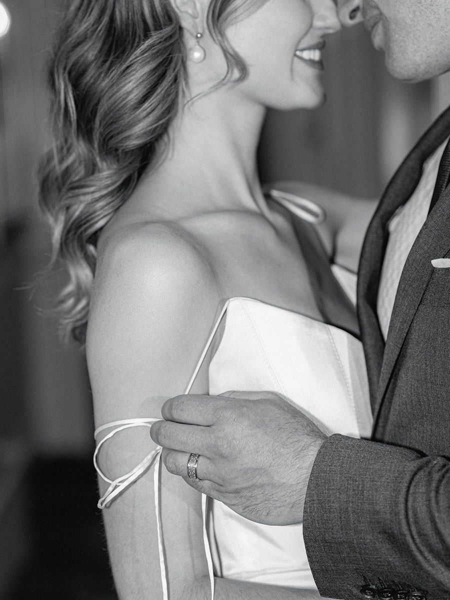 Bride and groom wedding portrait in front of Riga Fairmont Hotel