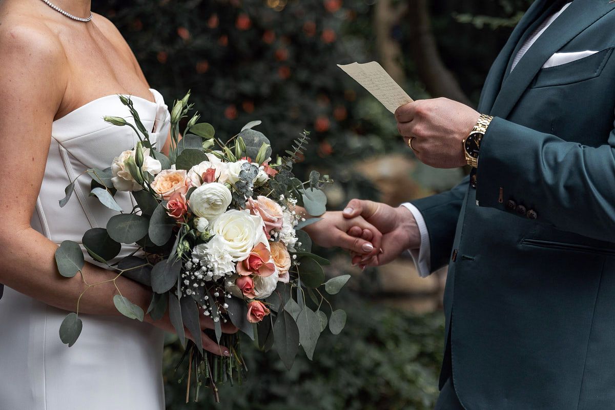 Emotional vow exchange as bride and groom hold hands during Riga wedding ceremony in Vecrīga