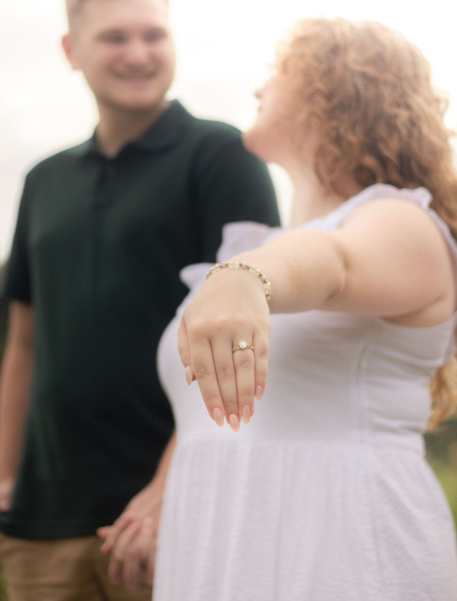 A romantic ring-focused engagement photo shoot showing close up shots of hands and jewelry.