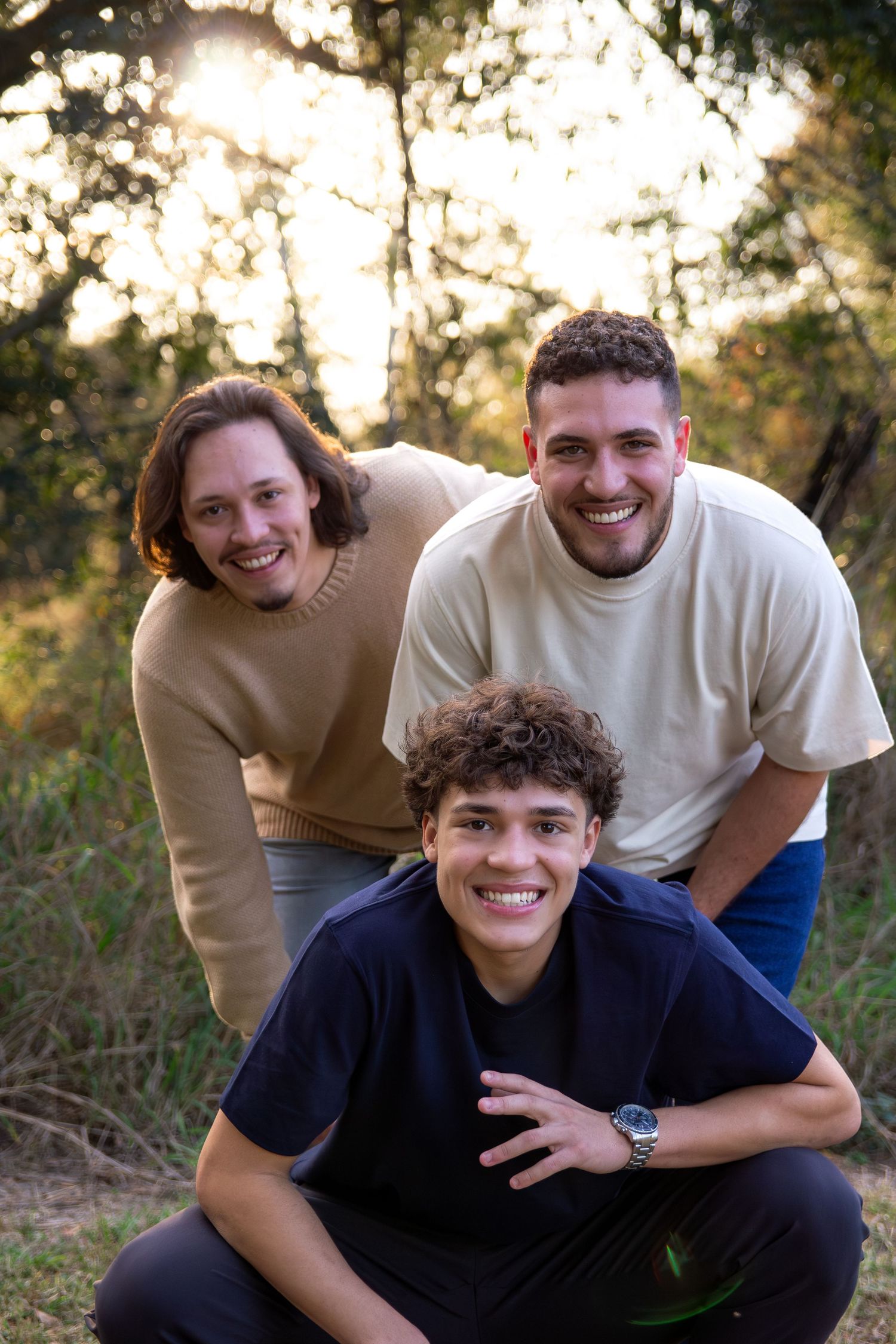 Three progressive photos show playful interaction between people outdoors with natural lighting and foliage in background.
