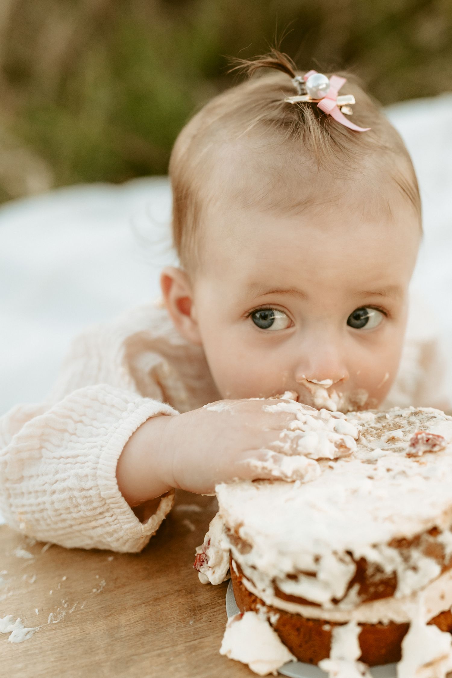 Close-up sequence of a cake smash photo session with frosting and excitement.