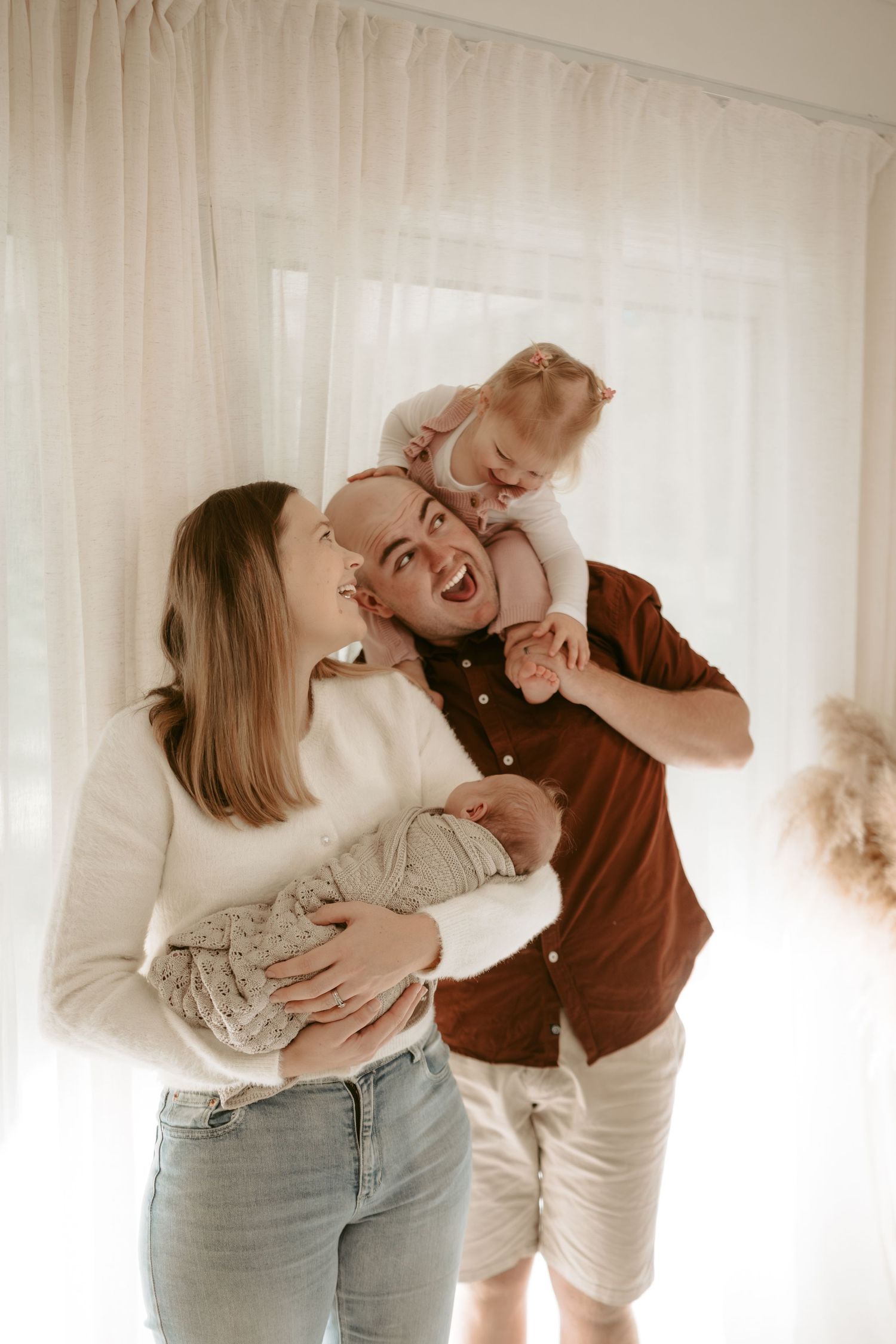 A sequence of candid indoor photos showing playful family moments in natural light.