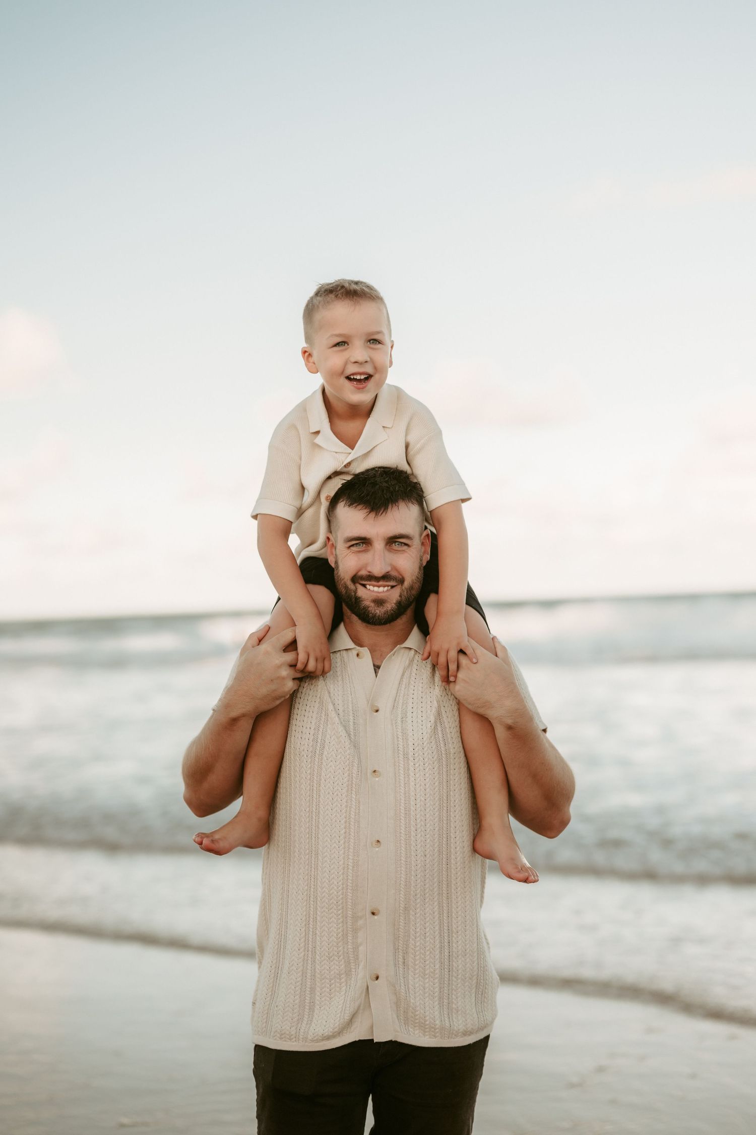 A joyful moment captured at the beach with playful interactions.