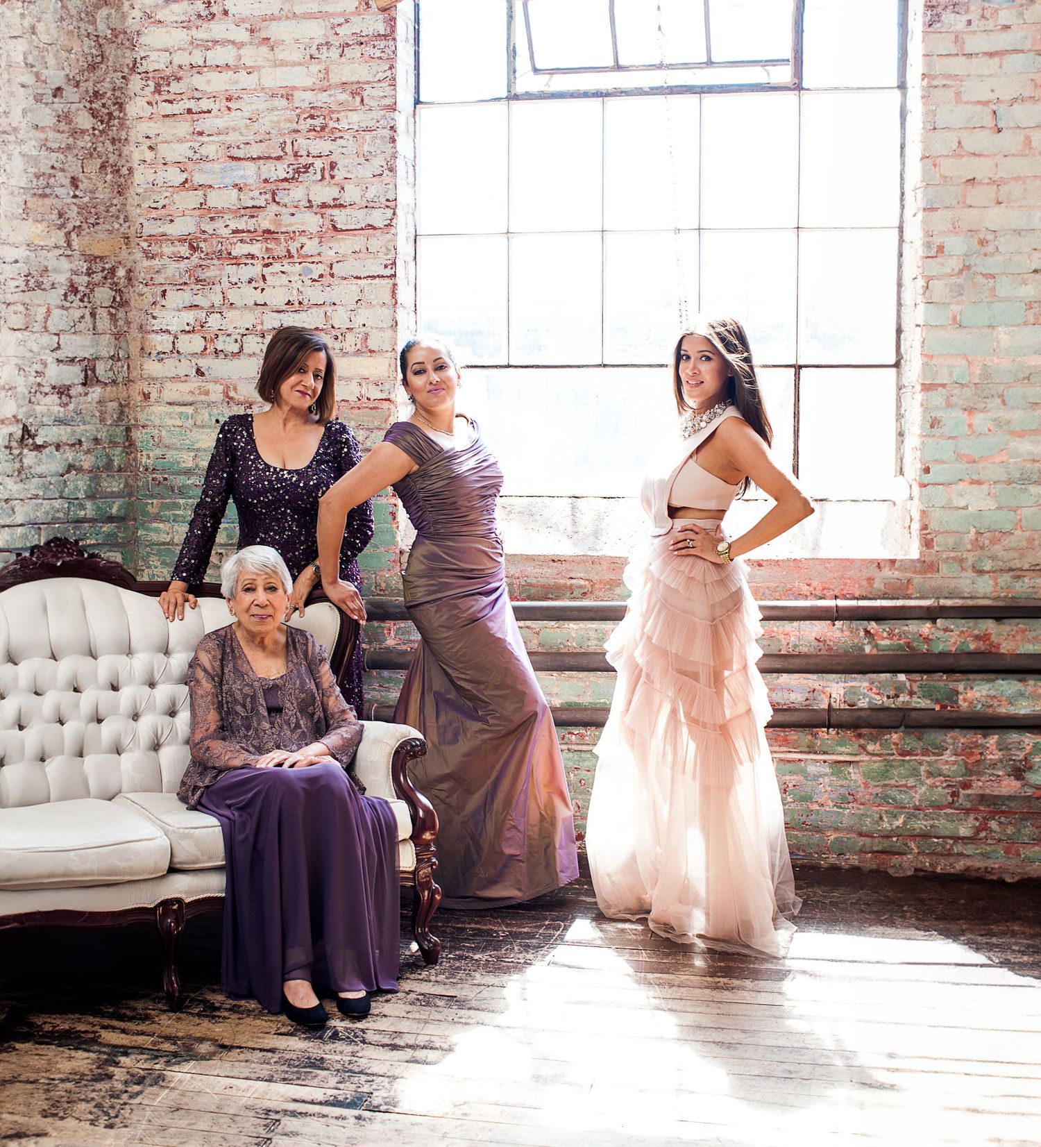 Studio portrait of a family in fancy dresses.