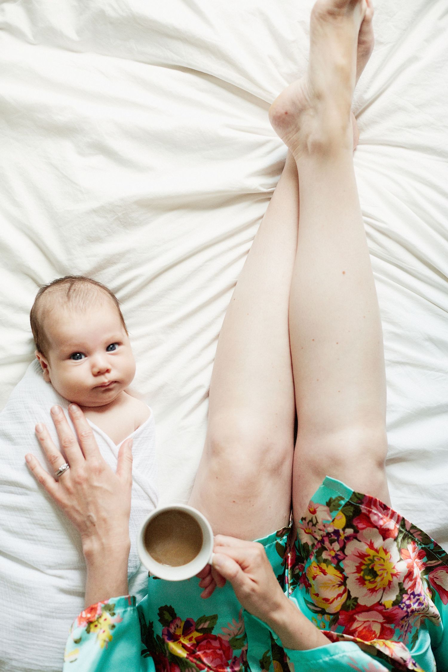 Mother and baby in bed.