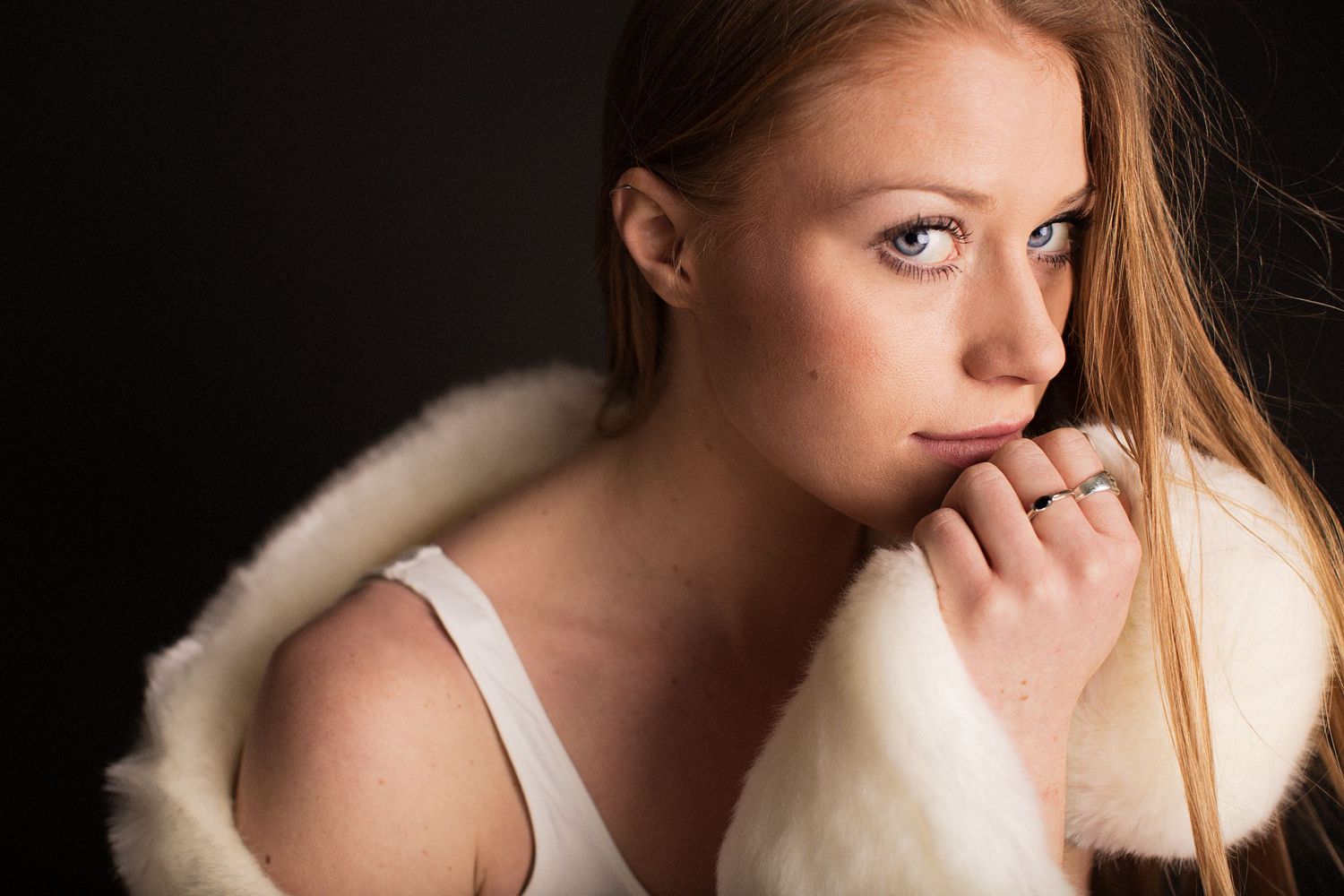 Model against black backdrop.