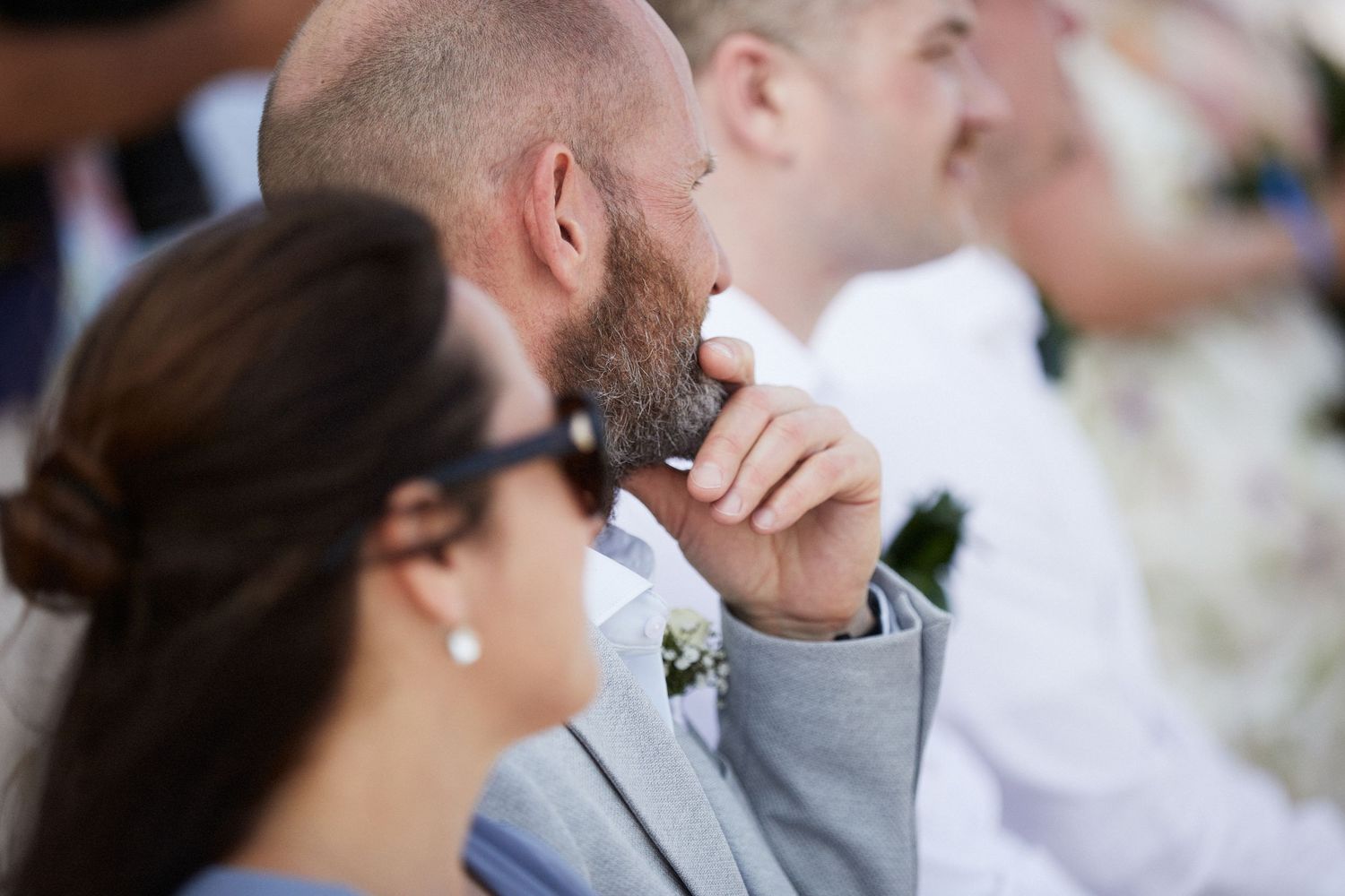 Crowd at wedding looking at couple during wedding ceremony.