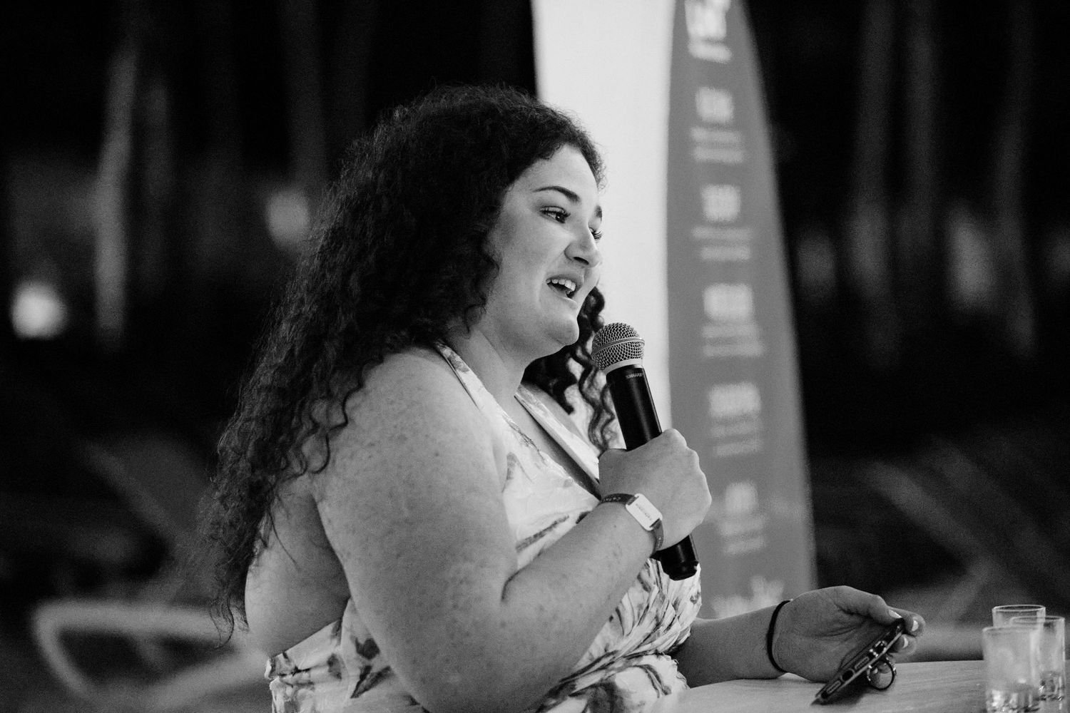 Photo of woman saying a heartfelt speech at her sisters wedding.