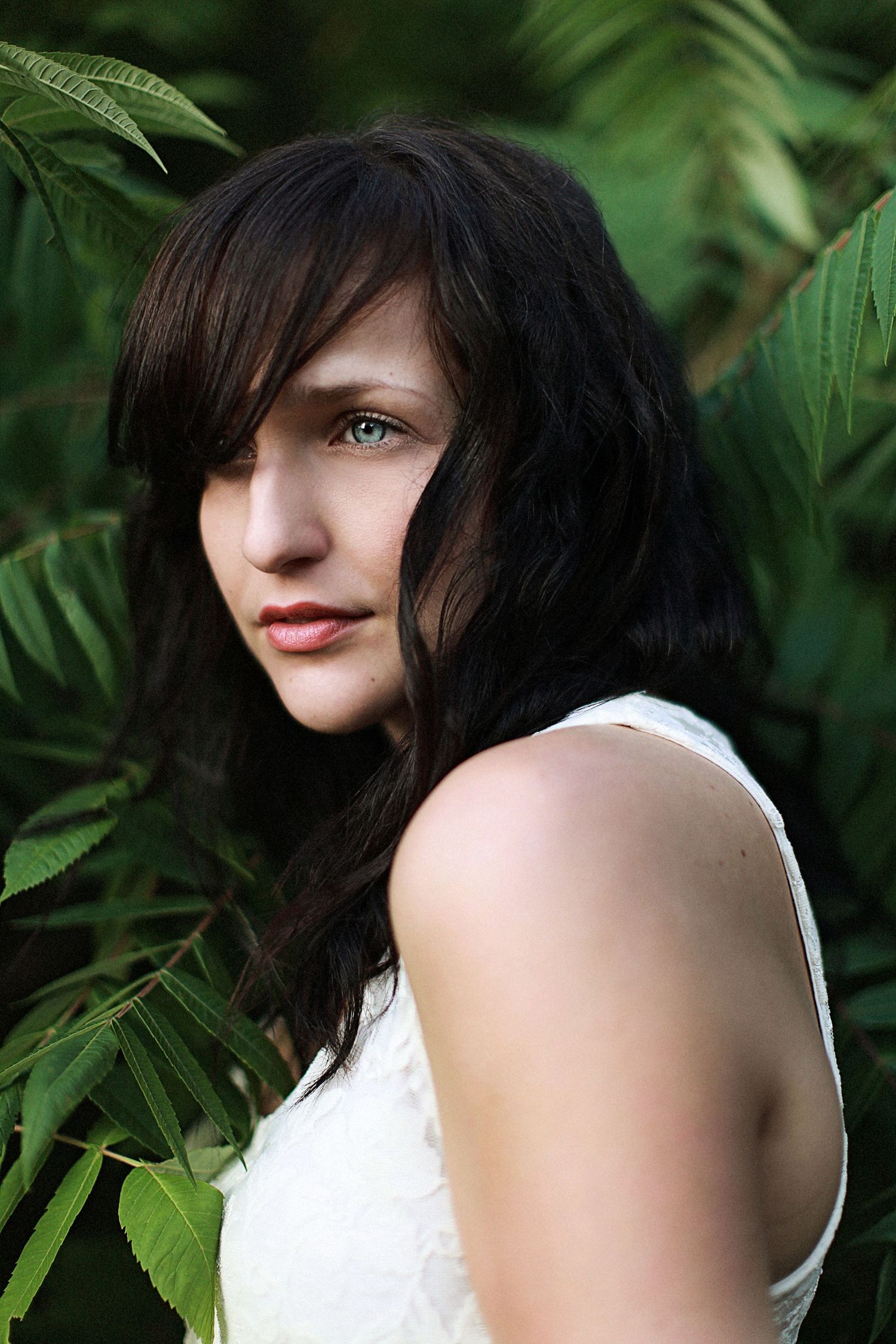 Model in greenery.