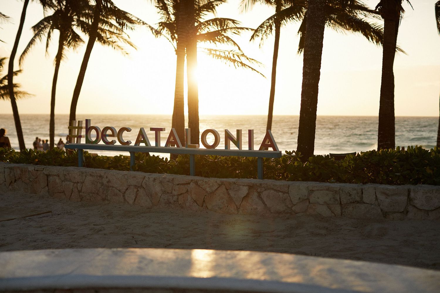 Photo of the Catalonia Royal Tulum resort sign at sunrise.