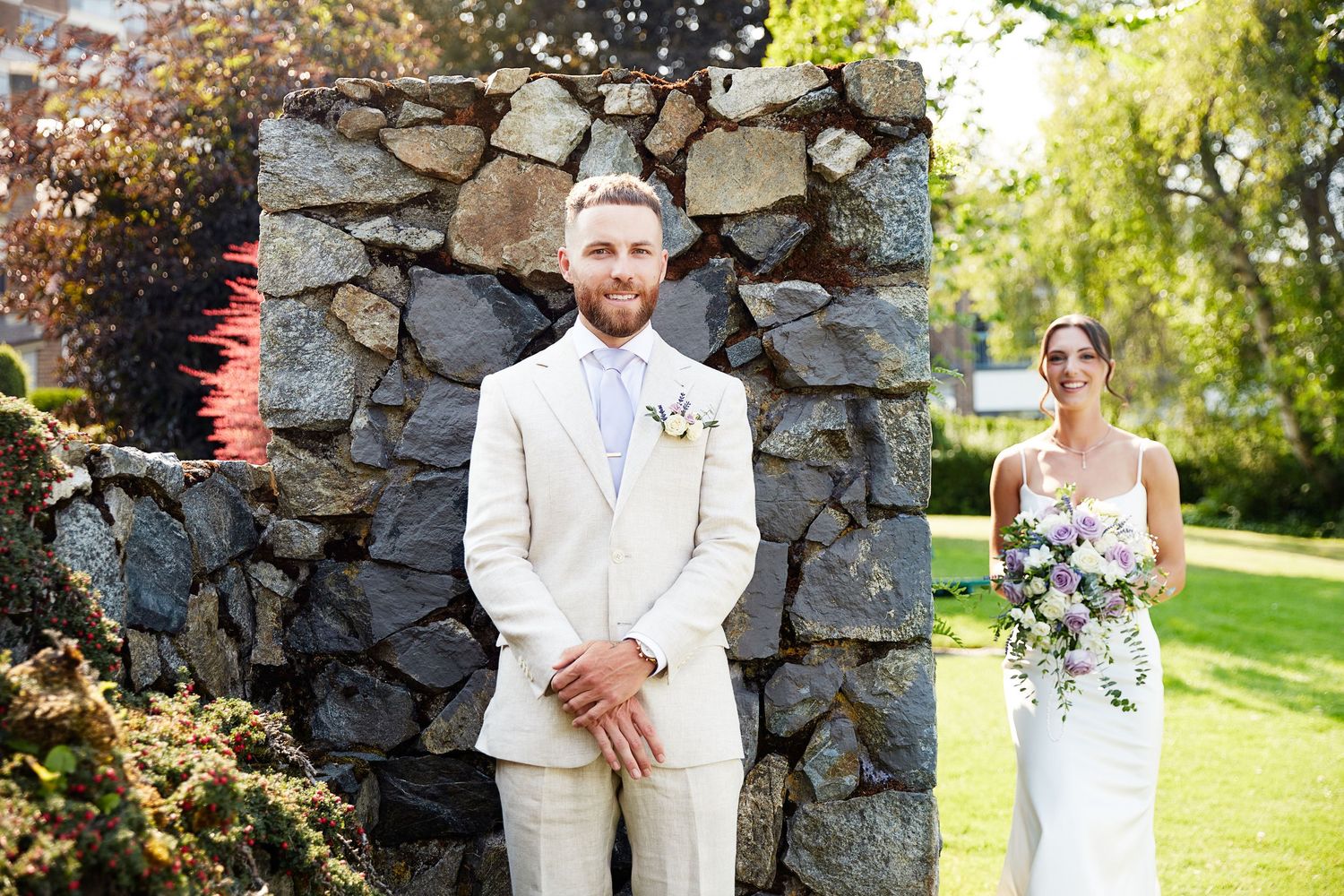 Pre-ceremony image of bride and groom doing a sneak peek.