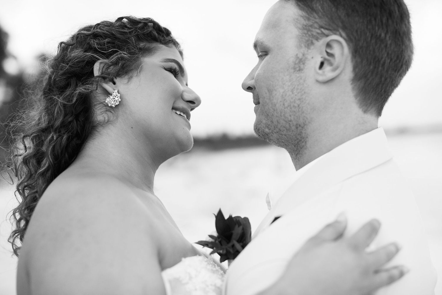 Bride and groom looking at each other, lovingly.