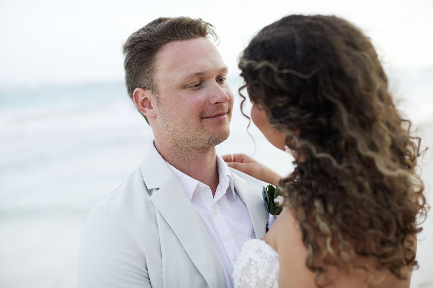 Bride and groom looking at each other, lovingly.