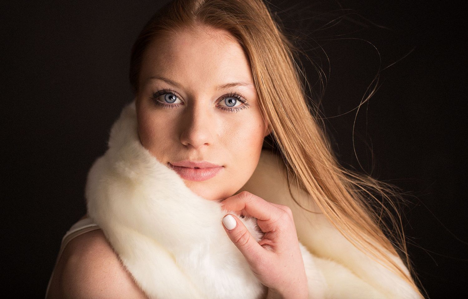 Model against black backdrop.