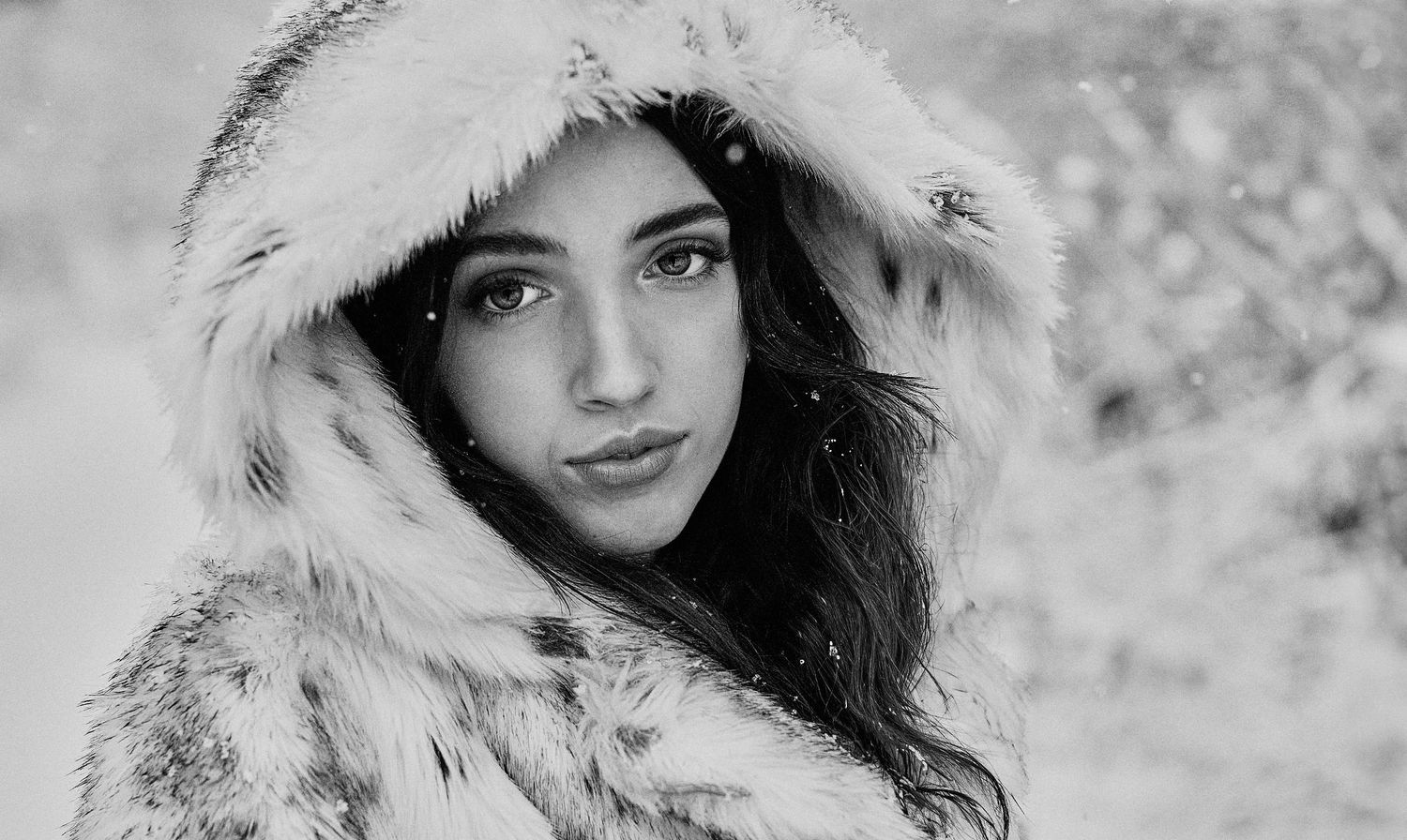 Model in fur coat in a winter wonderland.