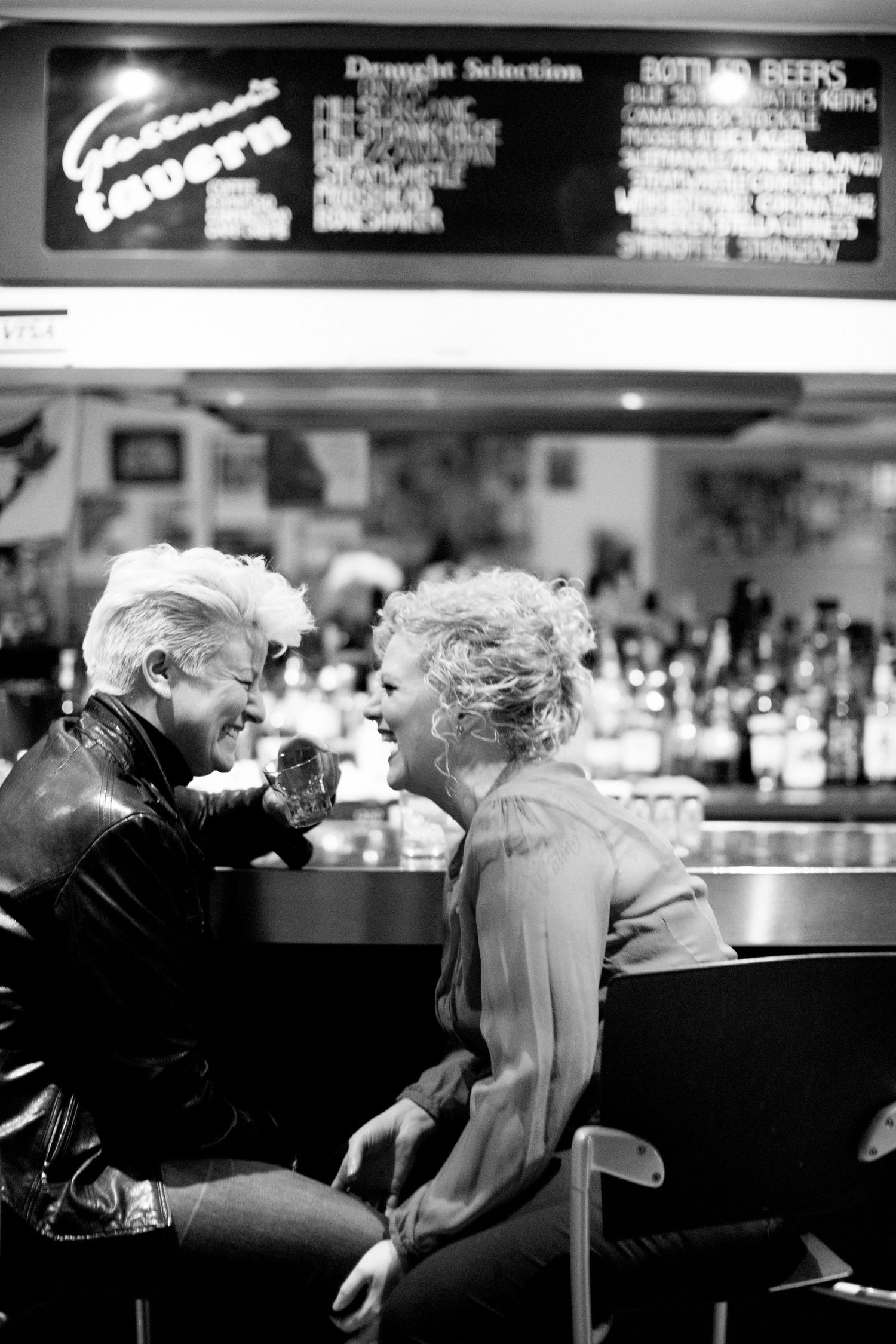 Couple laughing together.