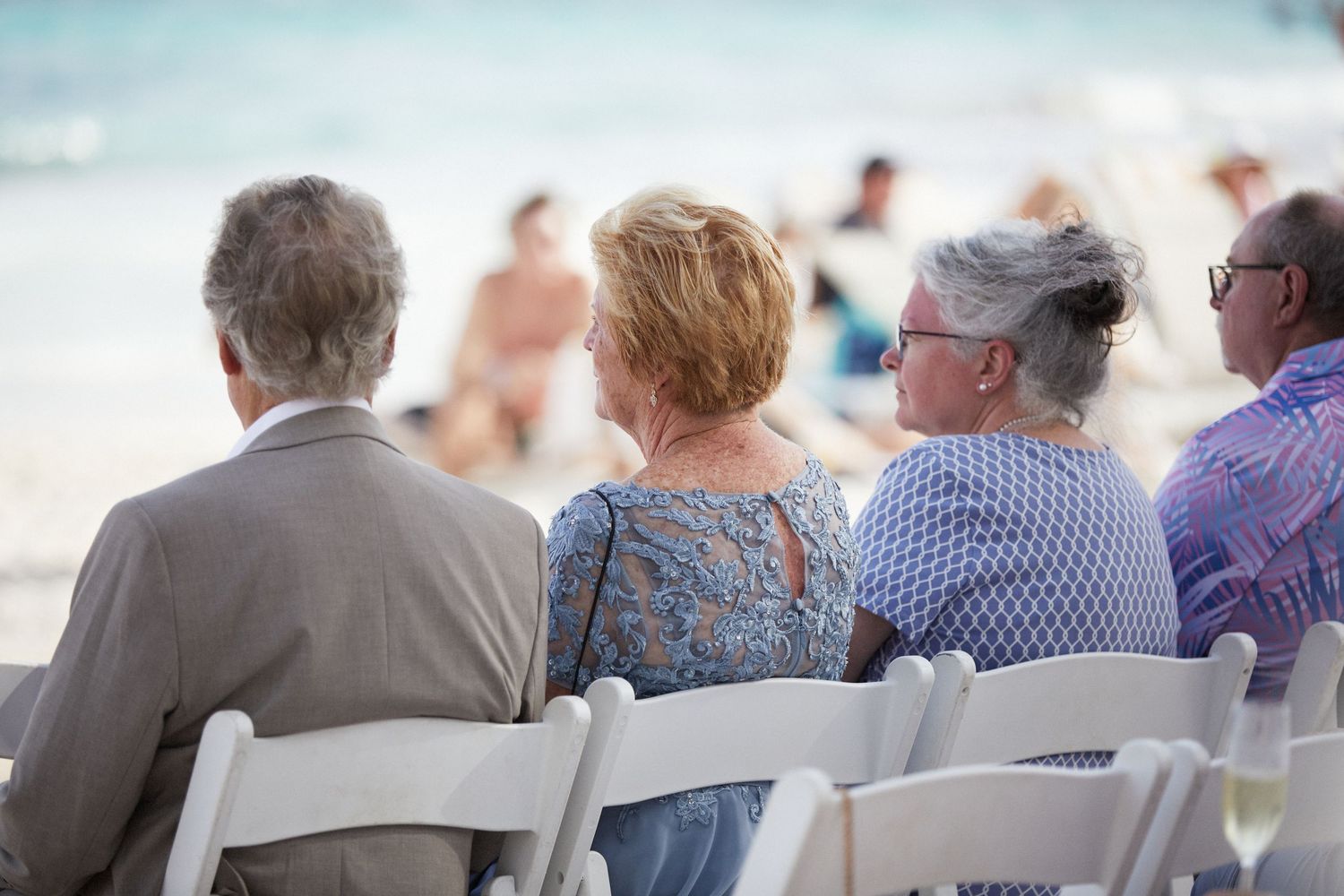 Wedding guests watching ceremony.