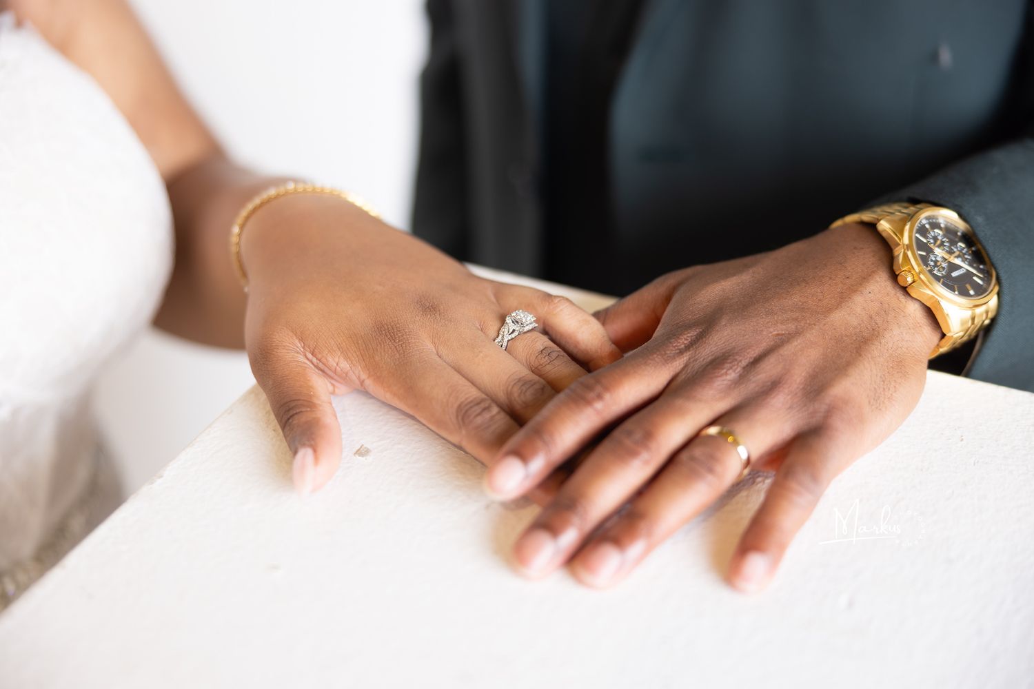 Close up view of hands holding engagement ring box during romantic marriage proposal.