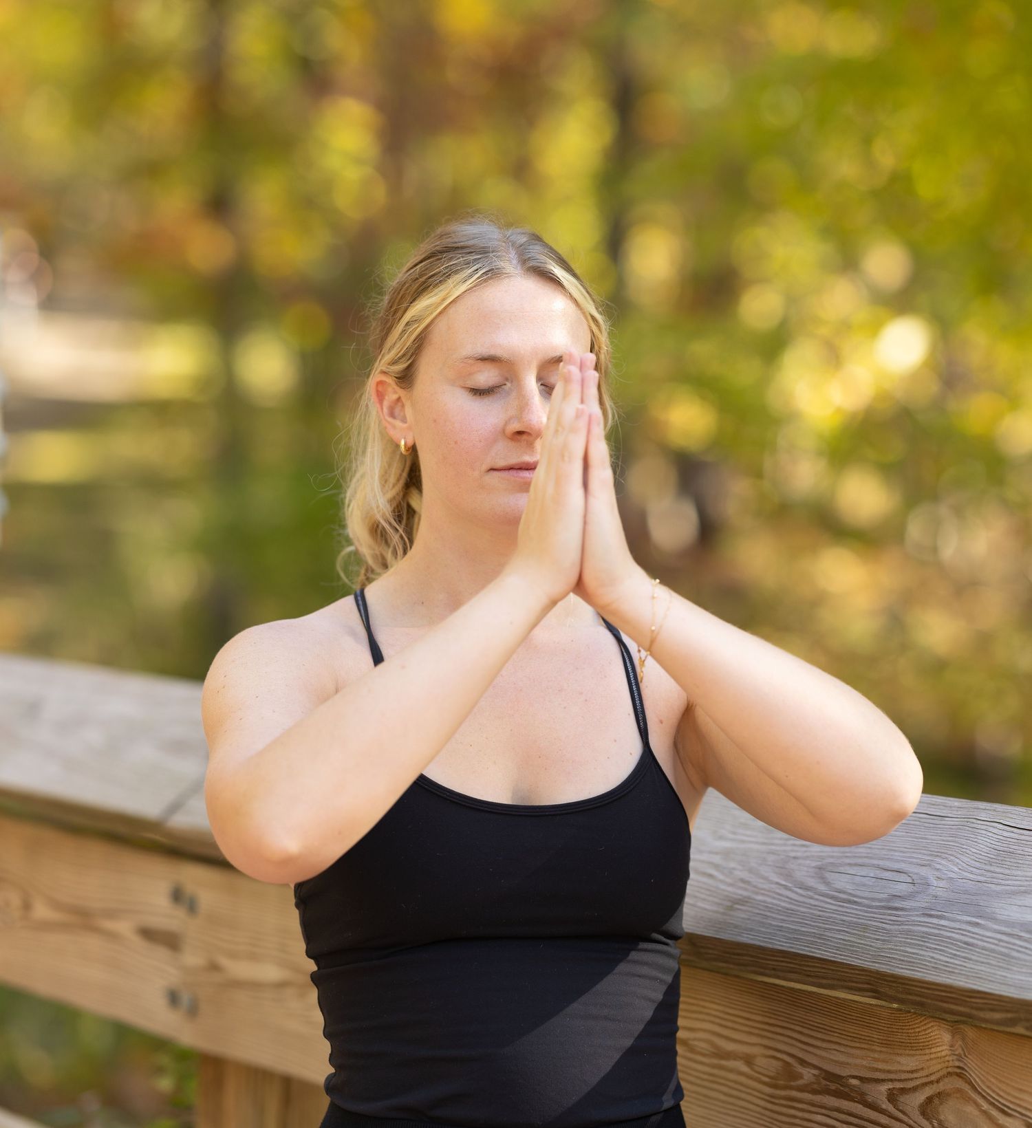 Person in black tank top doing 