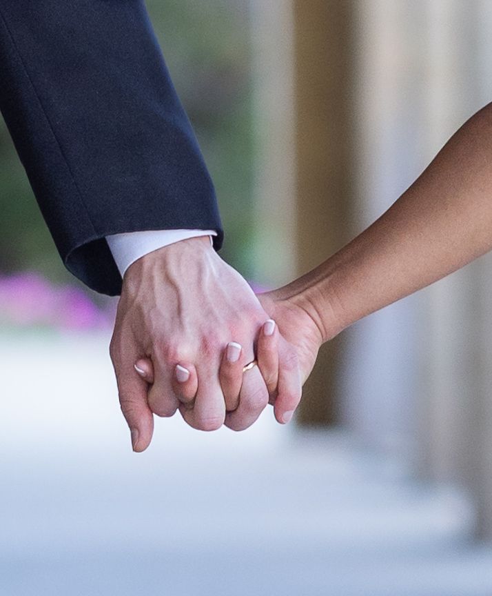 Close-up sequence of hands joining together in unity and support against a soft blurred background.