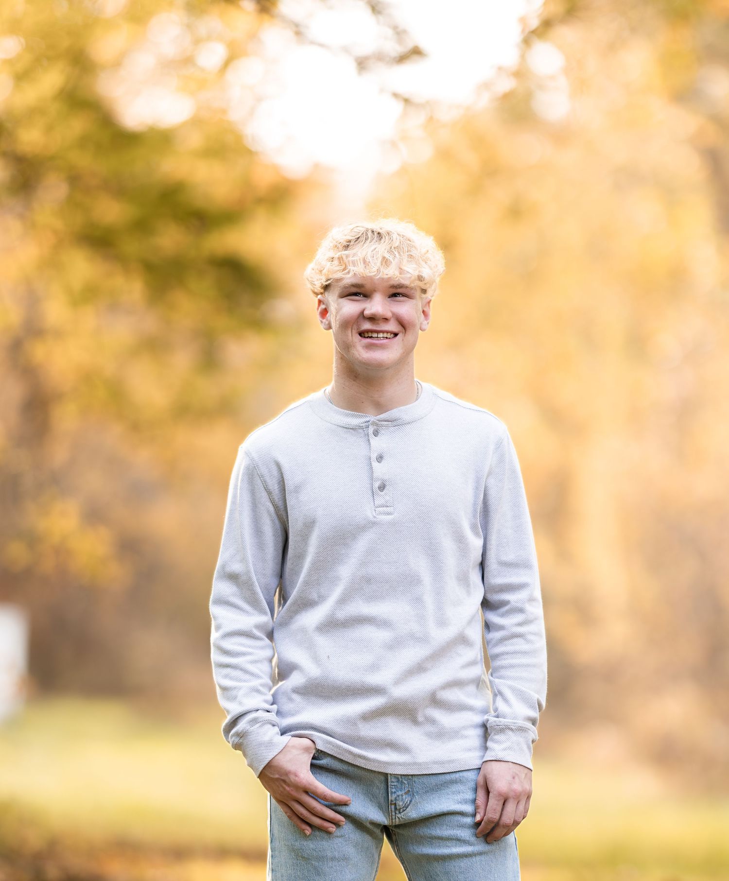 Casual outdoor portrait series in grey henley shirt during golden hour.