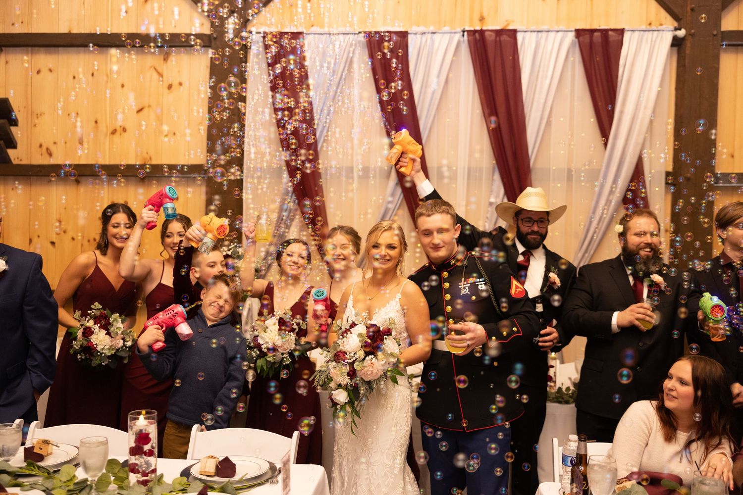 A collage of wedding celebration moments showing dancing, toasts, and joyful interactions at an elegant reception venue.