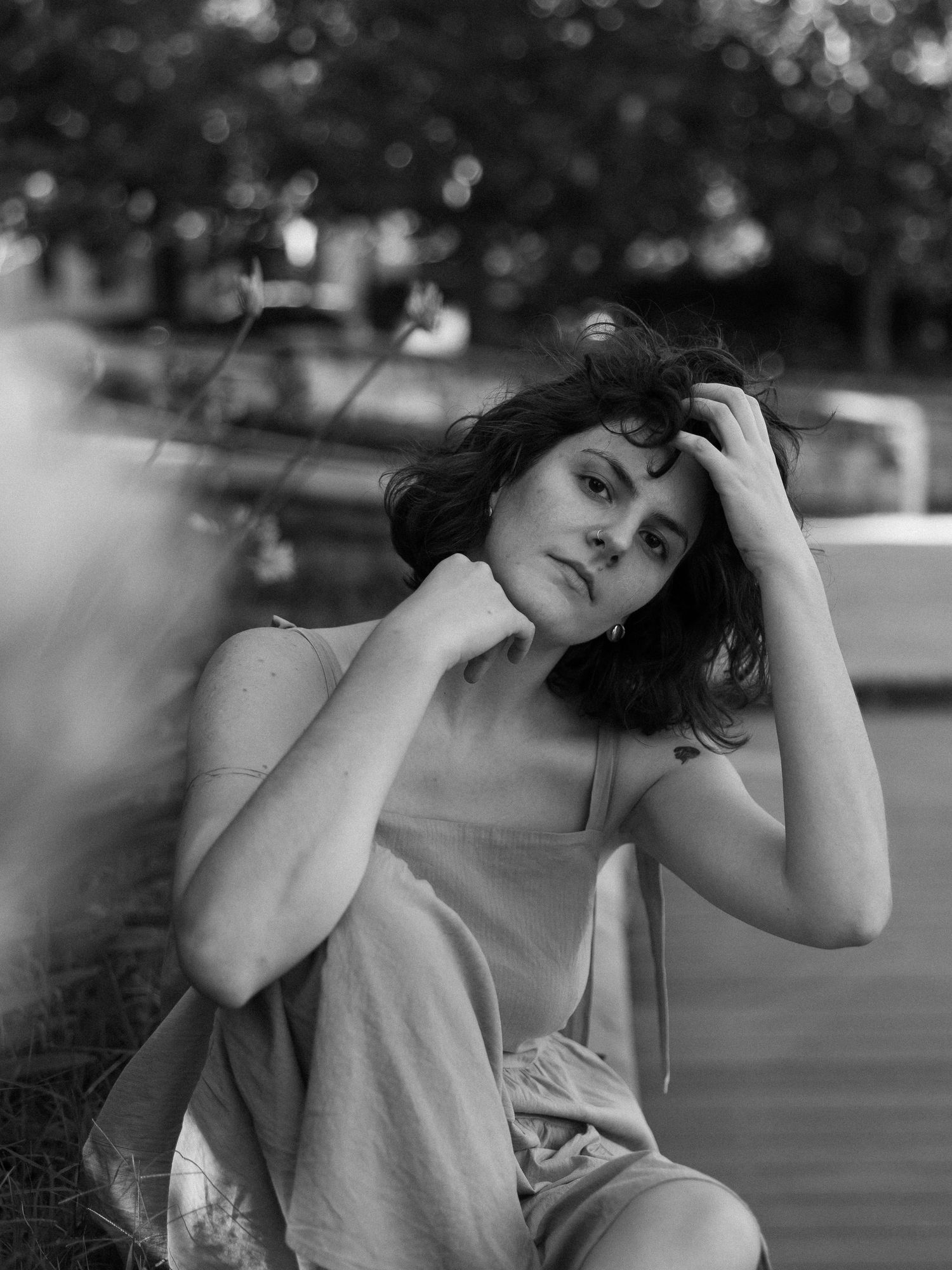 A black and white portrait with dramatic shadows and emotive poses.