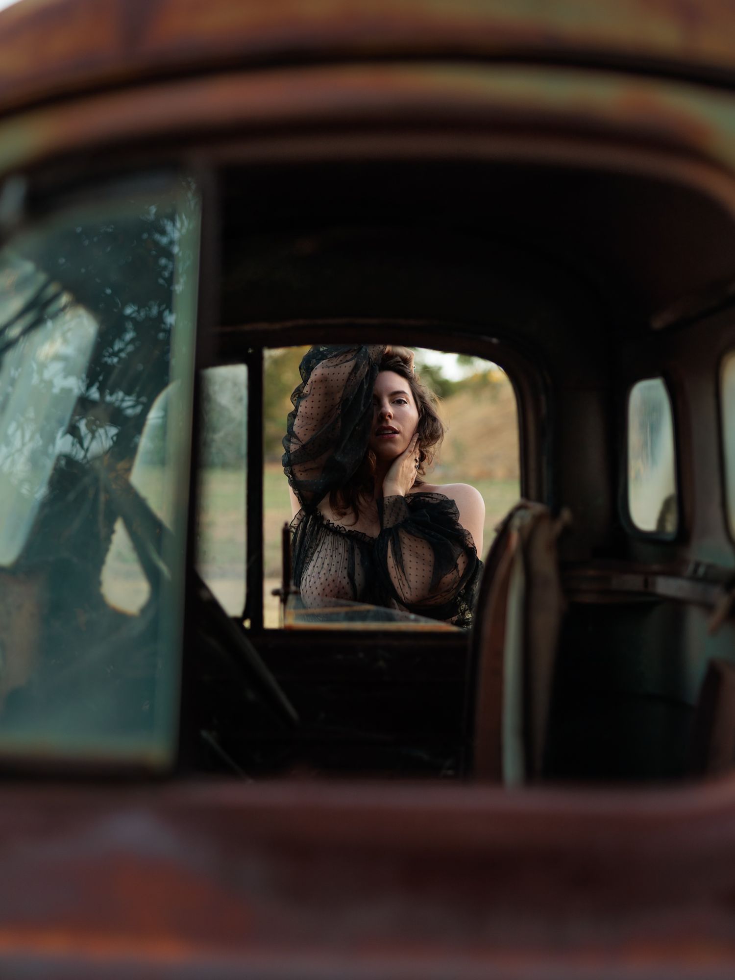 View through car window shows someone peering in from outside in a cinematic shot sequence.