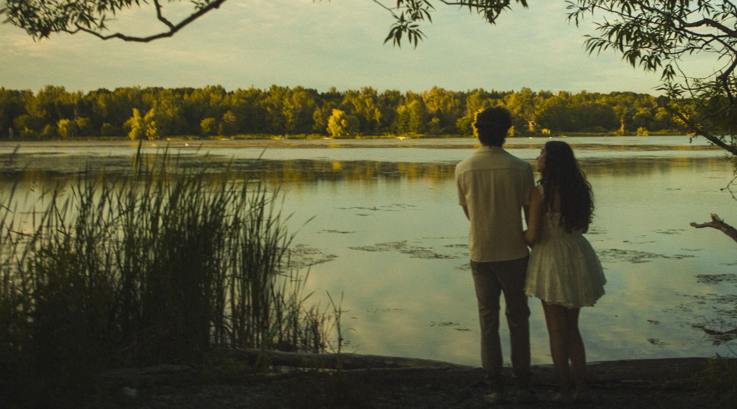 Cinematic documentary-style couples photography taken in Toronto nature, candid and emotional interaction, beach