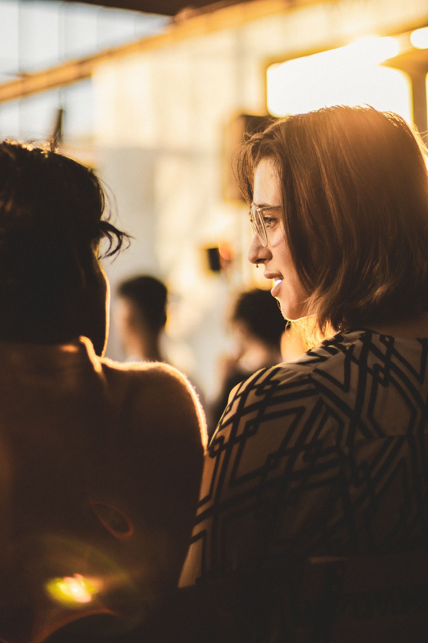 Candid musical event photography, golden hour sun flare